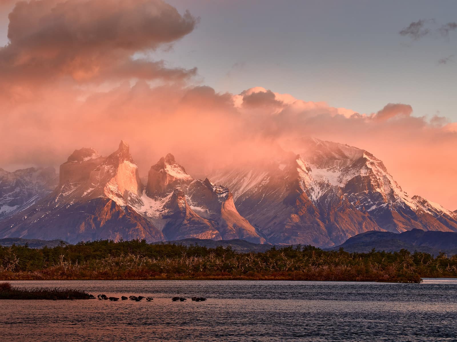 The Cuernos del Paine above Lago Pehoé, weather stacking behind the horns.