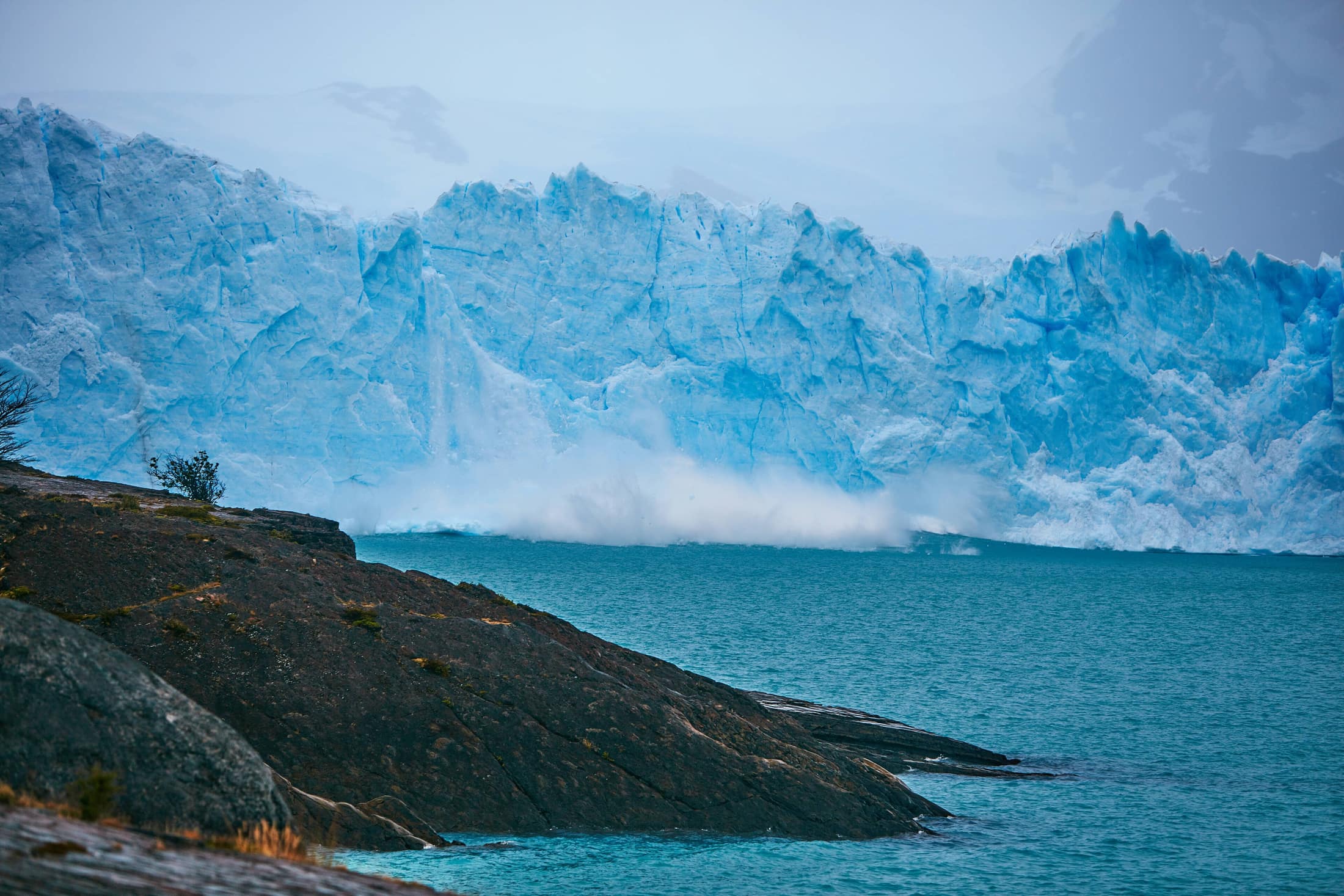 Open Patagonian country running toward a wall of mountains.