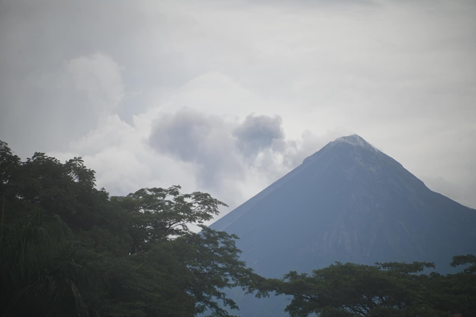 Fuego venting ash beside the shoulder of Acatenango.