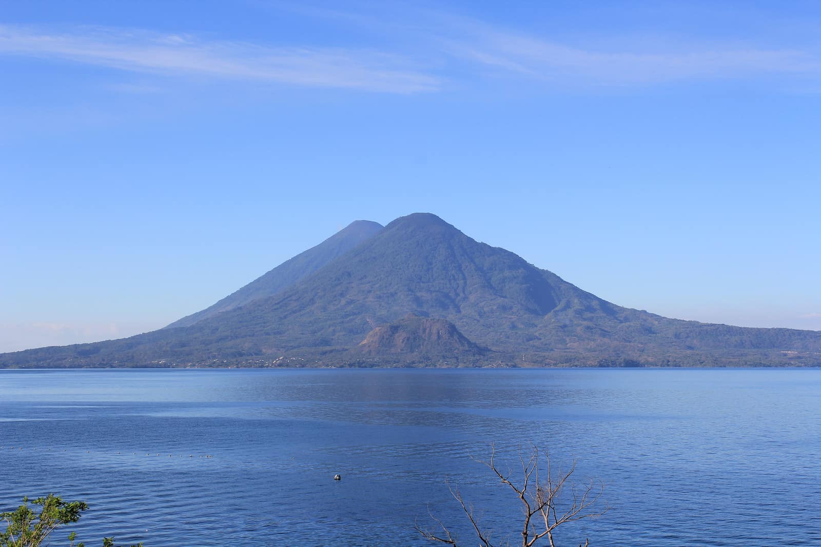 Lake Atitlán under cloud with the Tolimán and Atitlán cones behind.