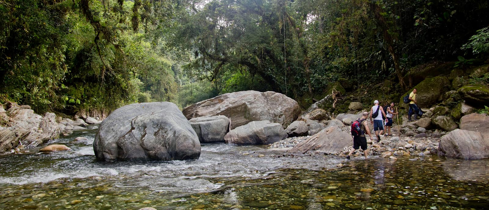 A river crossing on the walk in to Teyuna, water running fast over stone.